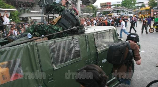 Anti coup protesters chase away soldiers